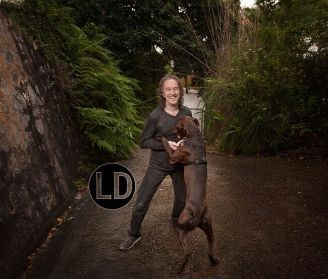 Shane Collens photographed with his dog Seal at his Cascade home